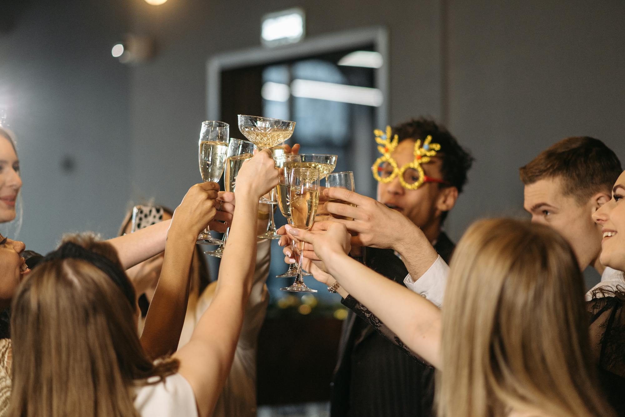 Group toasting champagne glasses at a corporate celebration