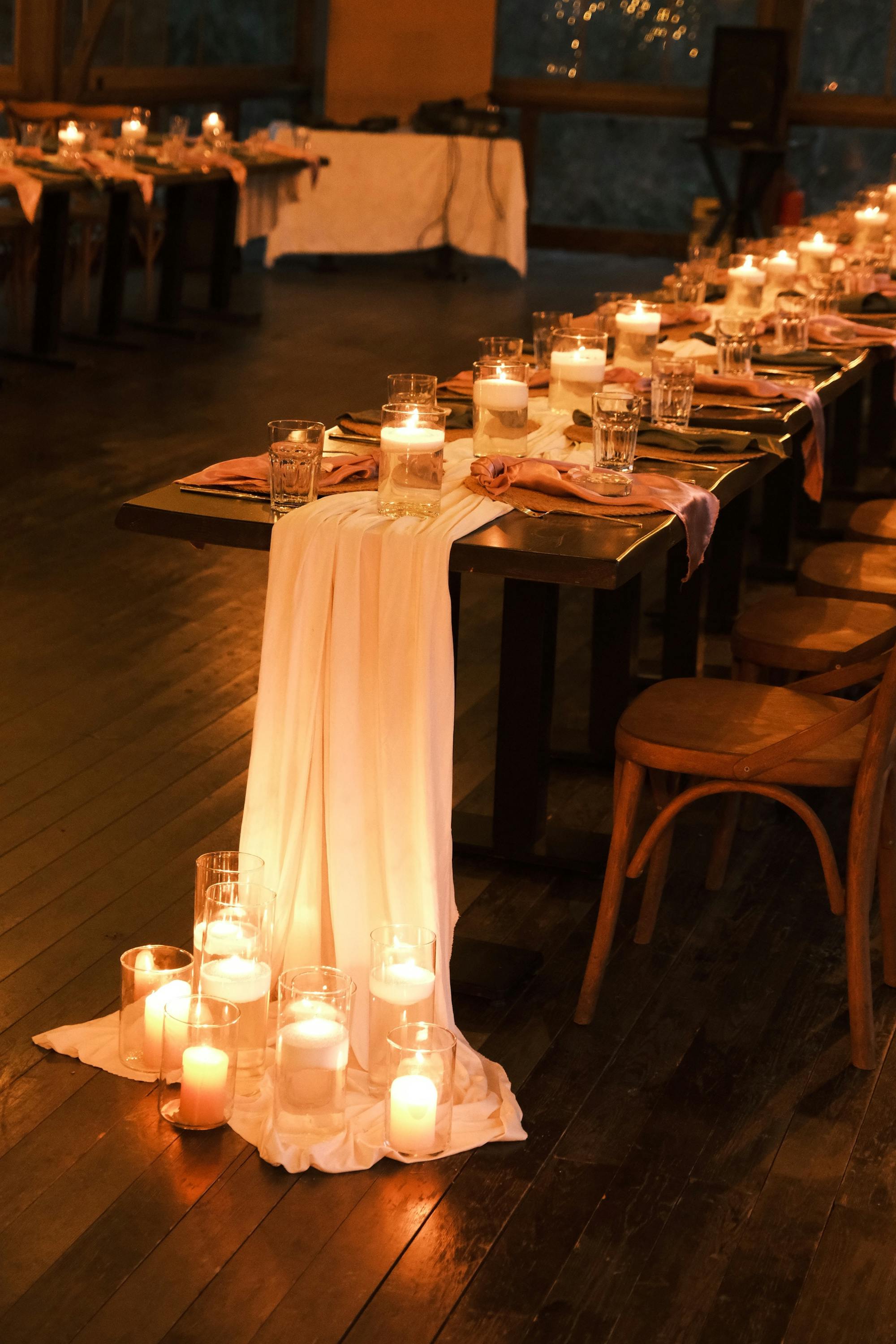 Anniversary table with chiffon runner and floor candles