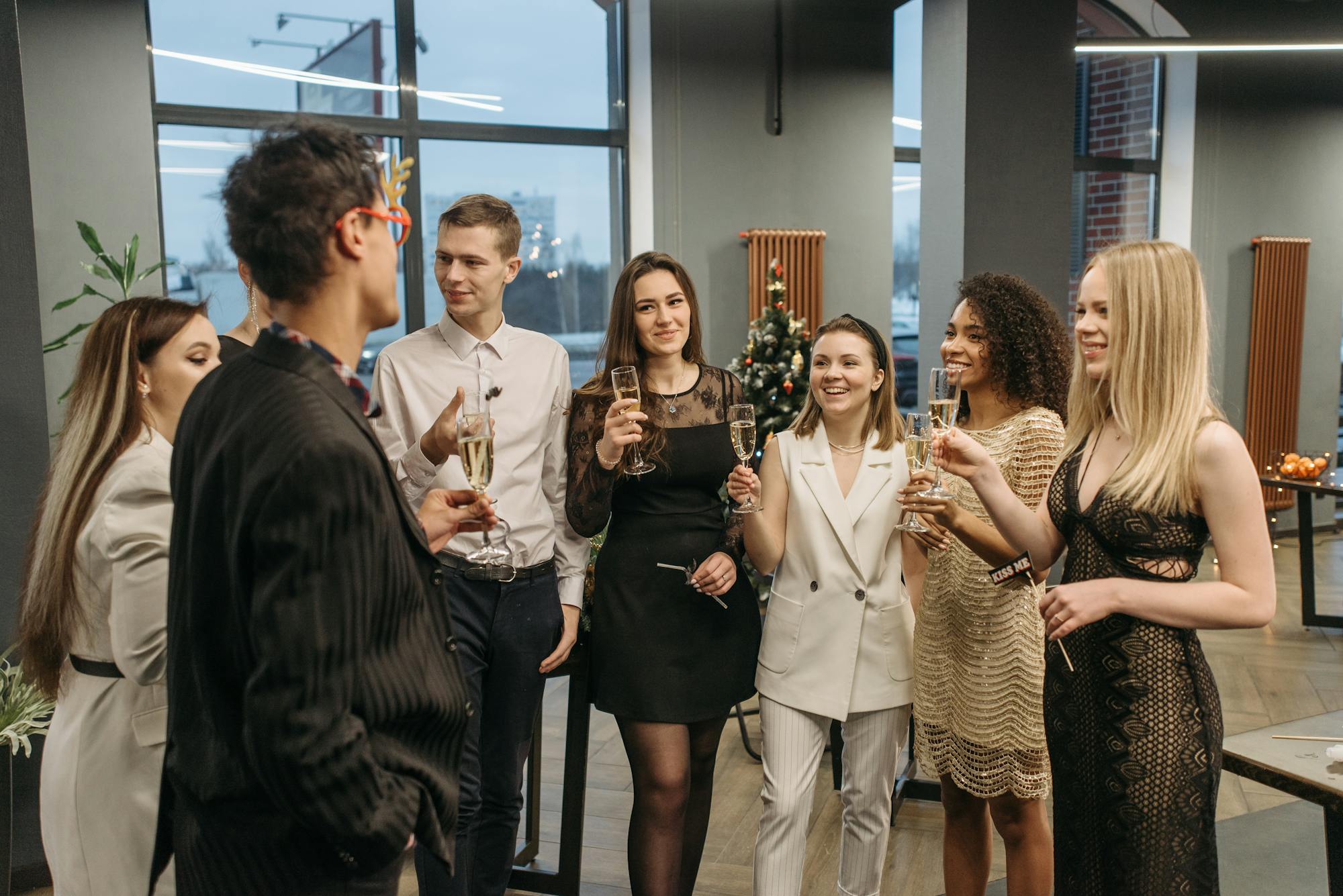 Colleagues networking with drinks at a corporate party