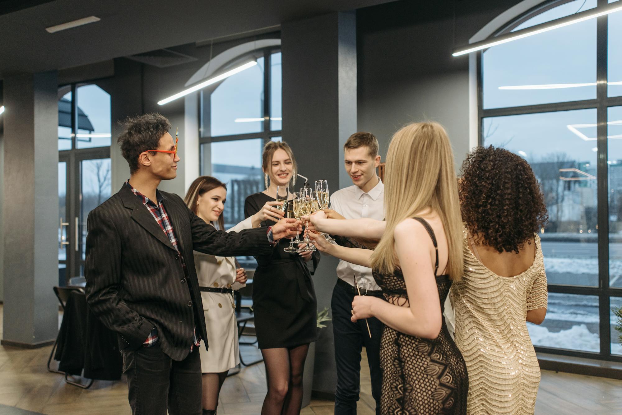 Group of business professionals networking with champagne